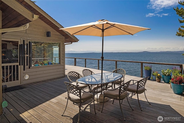 681 Smugglers Cove Rd, Friday Harbor, WA 98250 - wooden terrace with a water view and outdoor dining space