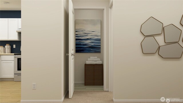 corridor with light carpet and baseboards