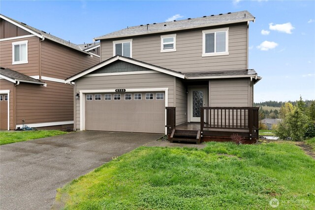 6733 Birdseye Ave NE, Lacey, WA 98516 - view of front of home featuring a garage, driveway, and roof with shingles