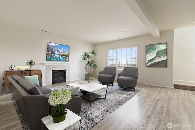 6733 Birdseye Ave NE, Lacey, WA 98516 - living area with beamed ceiling, recessed lighting, wood finished floors, a tile fireplace, and baseboards