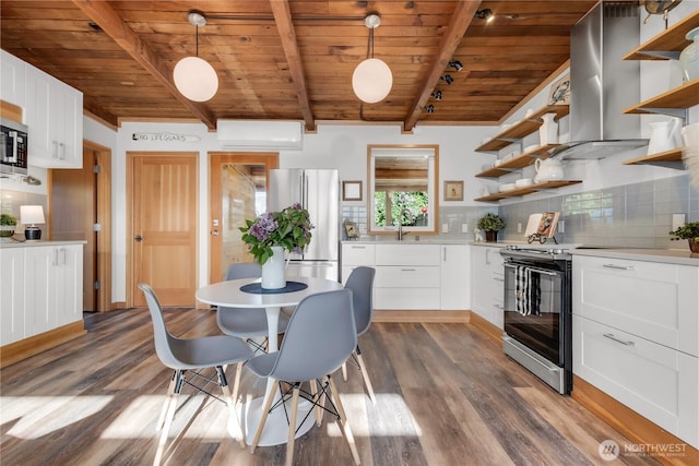 kitchen featuring open shelves, range hood, freestanding refrigerator, and wooden ceiling