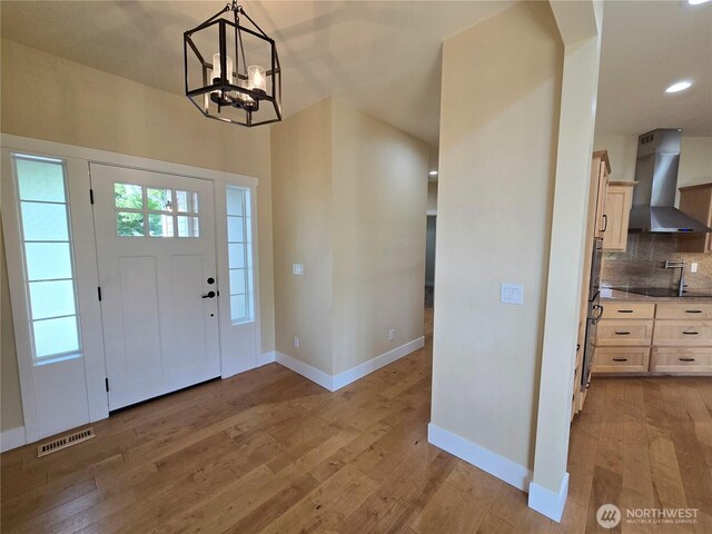90 Broadmoor St, Sequim, WA 98382 - entryway featuring light wood-style flooring, baseboards, a chandelier, and recessed lighting