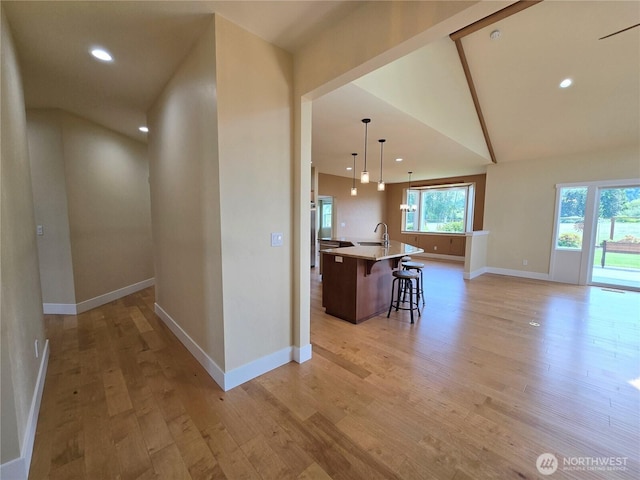 90 Broadmoor St, Sequim, WA 98382 - kitchen featuring a sink, light wood-style flooring, baseboards, lofted ceiling, and recessed lighting