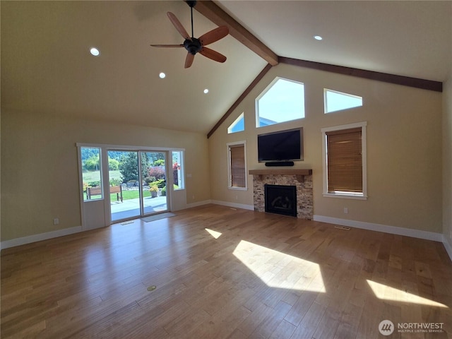 90 Broadmoor St, Sequim, WA 98382 - unfurnished living room featuring beam ceiling, high vaulted ceiling, ceiling fan, wood finished floors, and baseboards