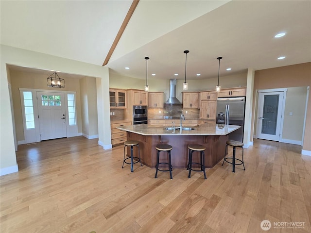 90 Broadmoor St, Sequim, WA 98382 - kitchen with wall chimney exhaust hood, stainless steel appliances, baseboards, backsplash, and a breakfast bar
