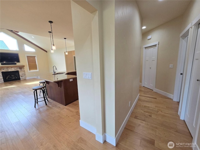 90 Broadmoor St, Sequim, WA 98382 - hallway featuring light wood-type flooring, baseboards, a sink, recessed lighting, and lofted ceiling