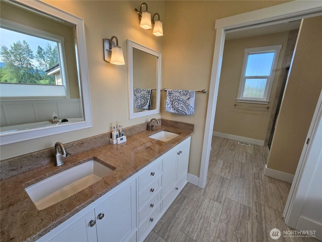 90 Broadmoor St, Sequim, WA 98382 - bathroom featuring baseboards and double vanity