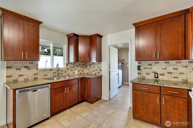 kitchen with dishwasher, backsplash, light stone counters, and a sink