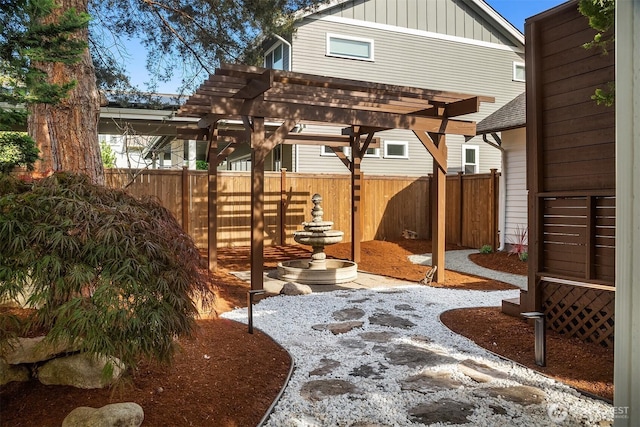 exterior space with a pergola and fence