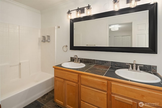 bathroom with crown molding, double vanity, shower / washtub combination, and a sink