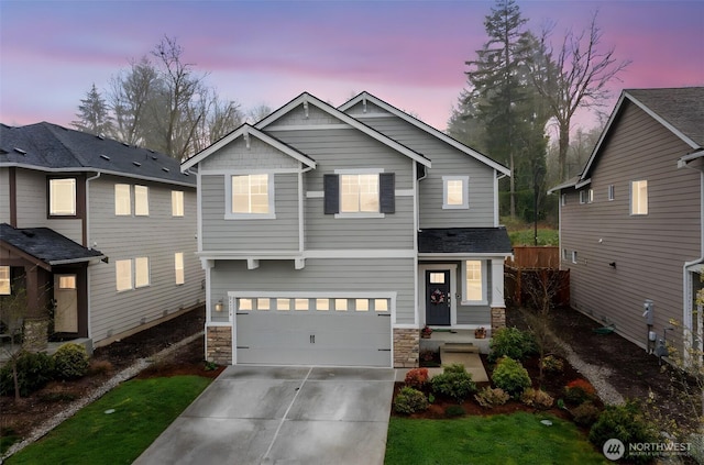 26334 203rd Pl SE, Covington, WA 98042 - view of front of home with stone siding, driveway, and a garage