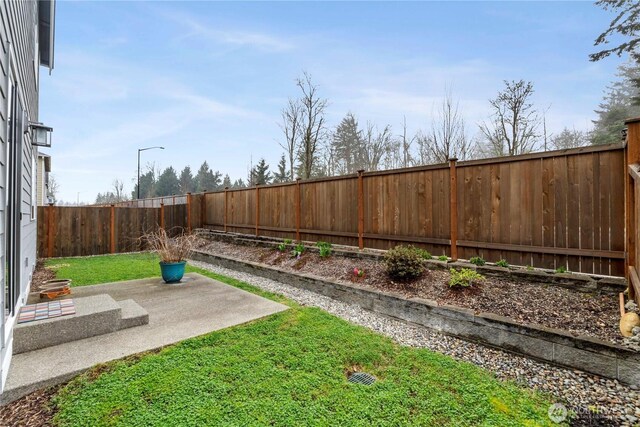 26334 203rd Pl SE, Covington, WA 98042 - fenced backyard featuring a patio area