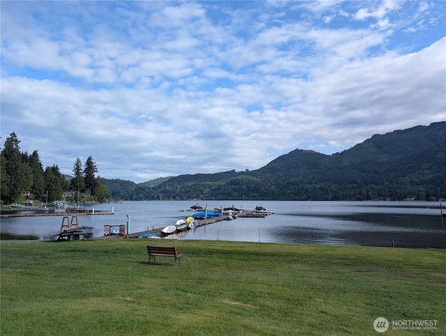 316 W Lake Samish Unit 30, Bellingham, WA 98229 - dock with a water and mountain view, a lawn, and a wooded view