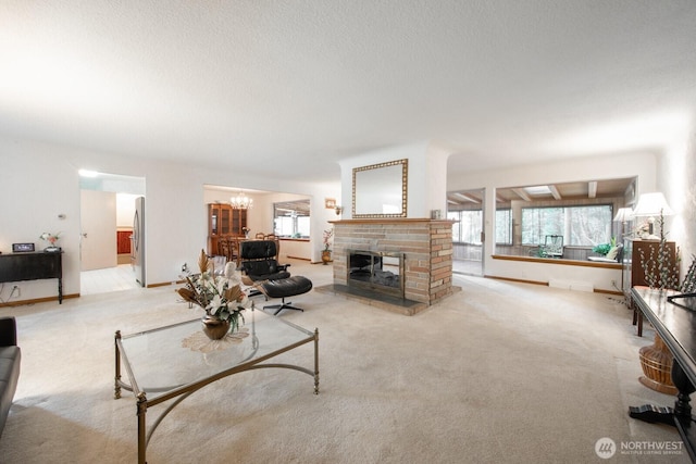 living room featuring a notable chandelier, carpet, and a wealth of natural light