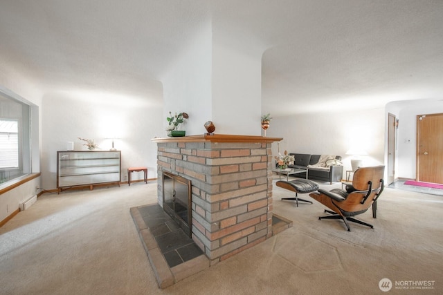 carpeted living room featuring a brick fireplace