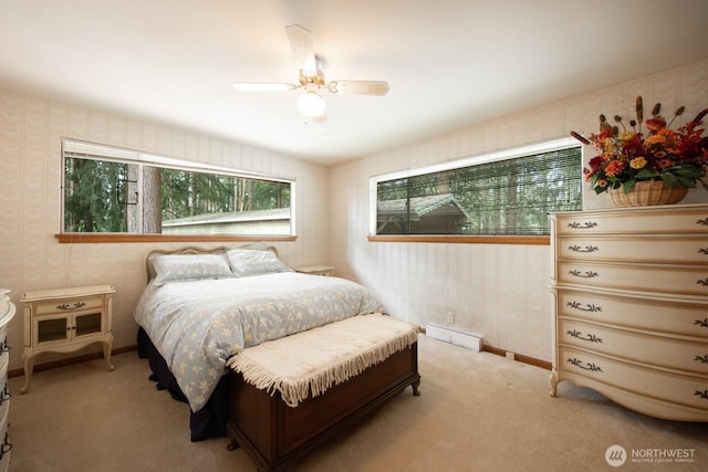 bedroom with baseboards, a ceiling fan, carpet, and wallpapered walls
