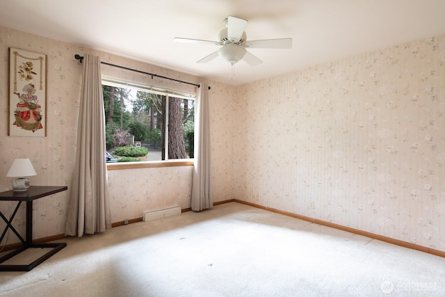 empty room featuring a baseboard radiator, carpet, baseboards, and wallpapered walls