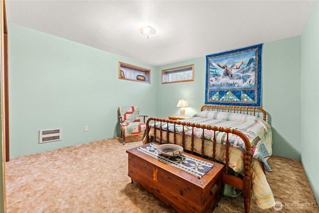 carpeted bedroom with heating unit