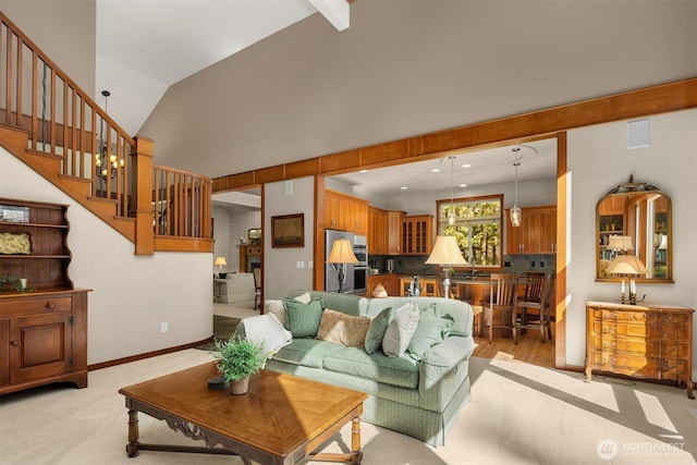 27909 SE 268th St, Ravensdale, WA 98051 - living area featuring stairway, light colored carpet, vaulted ceiling, baseboards, and visible vents