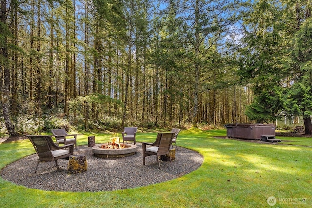 27909 SE 268th St, Ravensdale, WA 98051 - view of yard with an outdoor fire pit, a view of trees, and a hot tub