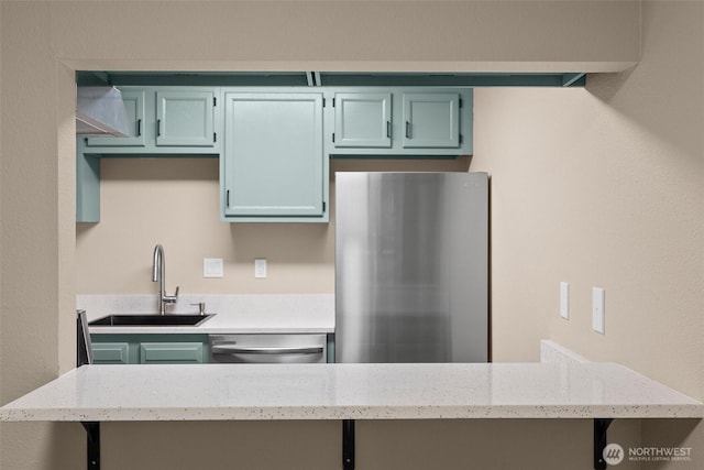 1700 Lake Park Dr SW Unit 8, Tumwater, WA 98512 - kitchen featuring a sink, light stone counters, and appliances with stainless steel finishes