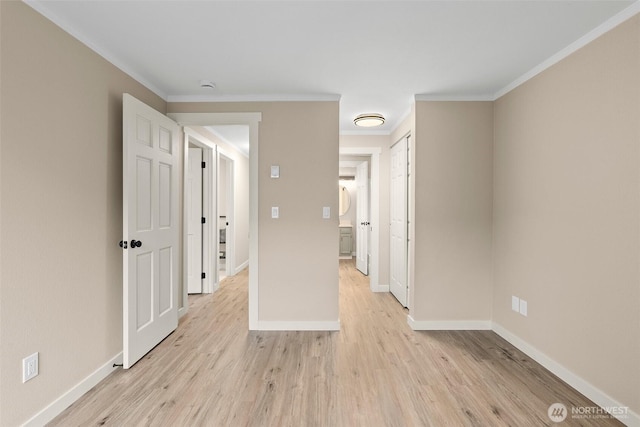 1700 Lake Park Dr SW Unit 8, Tumwater, WA 98512 - spare room featuring baseboards, light wood-type flooring, and crown molding