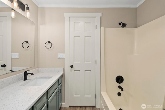 1700 Lake Park Dr SW Unit 8, Tumwater, WA 98512 - full bath with washtub / shower combination, wood finished floors, vanity, and ornamental molding