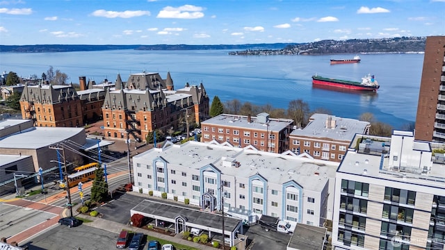 birds eye view of property with a water view
