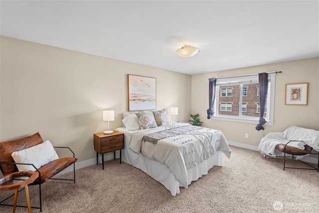 bedroom featuring baseboards and light colored carpet