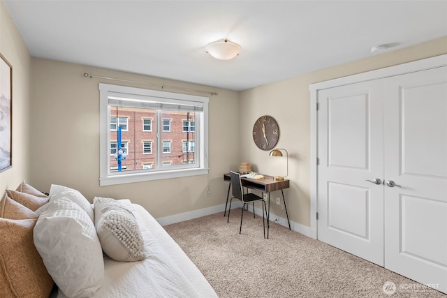 carpeted home office with baseboards