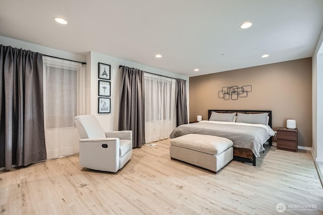 bedroom with light wood-style floors, baseboards, and recessed lighting