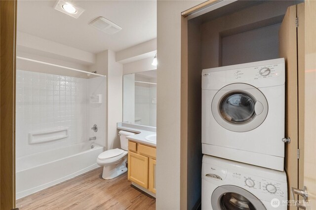 10240 Bridgeport Way SW, Lakewood, WA 98499 - washroom with stacked washer and dryer, visible vents, laundry area, and light wood-style floors