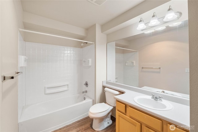 10240 Bridgeport Way SW, Lakewood, WA 98499 - full bath with bathtub / shower combination, toilet, vanity, and wood finished floors