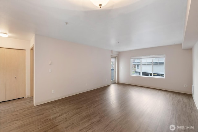 10240 Bridgeport Way SW, Lakewood, WA 98499 - unfurnished room featuring baseboards and wood finished floors