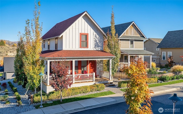 540 Porcupine Ln, Chelan, WA 98816 - view of front facade featuring roof with shingles, a porch, and board and batten siding