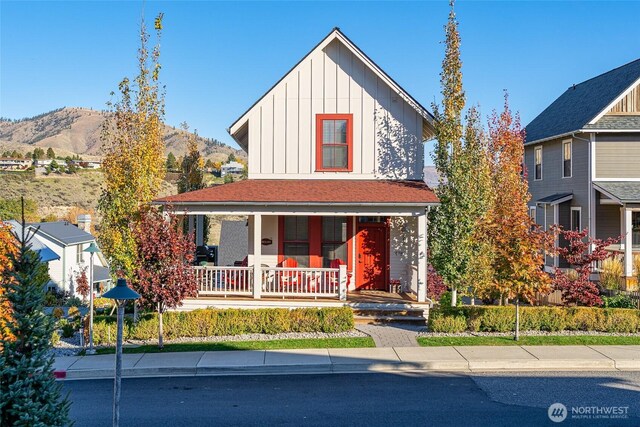 540 Porcupine Ln, Chelan, WA 98816 - view of front of house with a mountain view, board and batten siding, and covered porch
