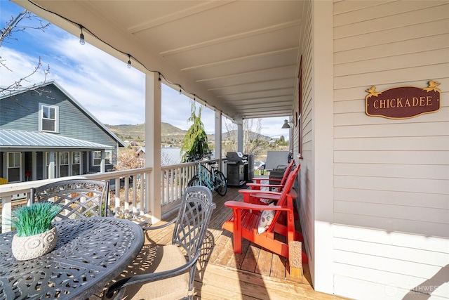 540 Porcupine Ln, Chelan, WA 98816 - wooden terrace with outdoor dining space and a mountain view