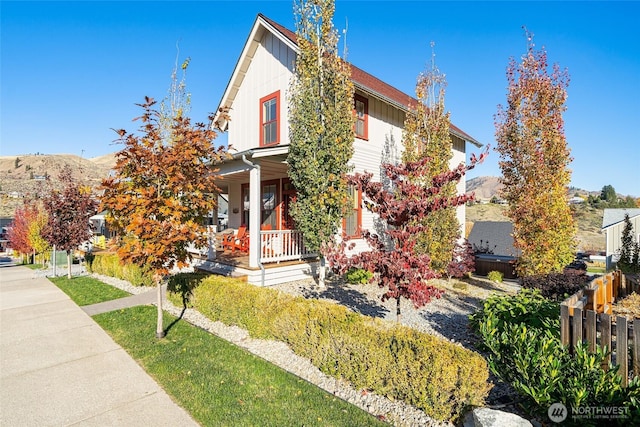 540 Porcupine Ln, Chelan, WA 98816 - view of front of home featuring board and batten siding, fence, and covered porch