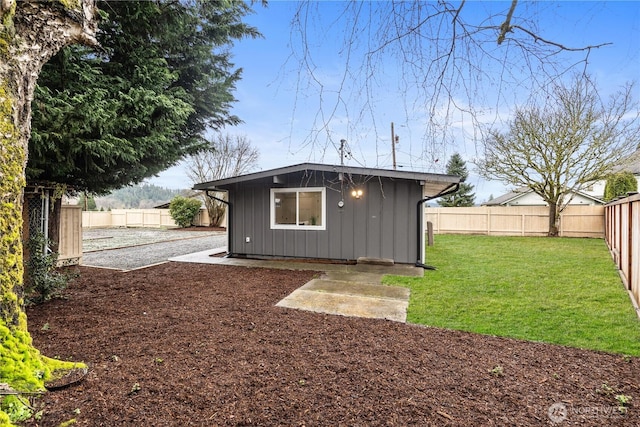 view of outbuilding with an outdoor structure and a fenced backyard