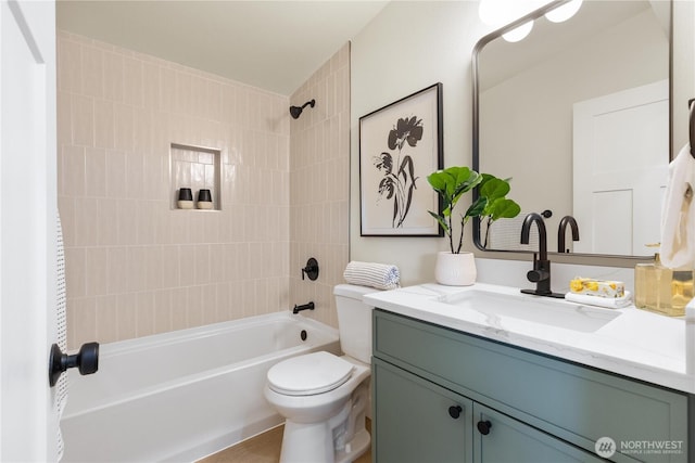 bathroom featuring bathtub / shower combination, toilet, and vanity