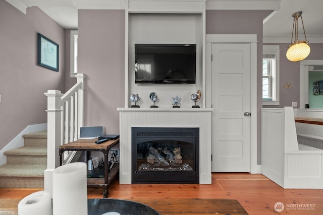 32 Madison Ln, Pacific Beach, WA 98571 - living area featuring stairs, wood finished floors, and a glass covered fireplace