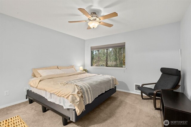 12427 129th Ave E, Puyallup, WA 98374 - bedroom with light carpet, baseboards, and a ceiling fan