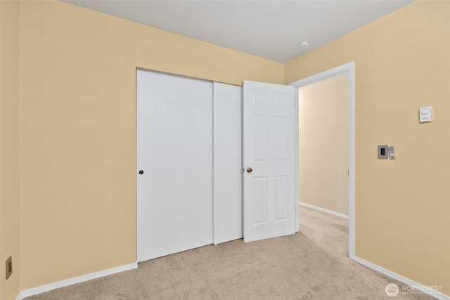 12427 129th Ave E, Puyallup, WA 98374 - unfurnished bedroom featuring carpet floors, baseboards, and a closet