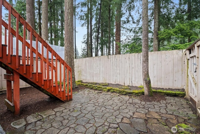 12427 129th Ave E, Puyallup, WA 98374 - view of patio featuring a fenced backyard and stairs