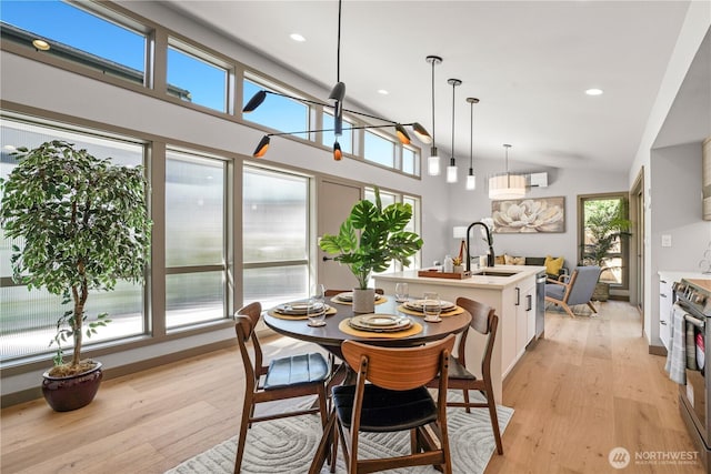 2324 NE 128th St, Seattle, WA 98125 - dining space featuring light wood-type flooring, lofted ceiling, and recessed lighting