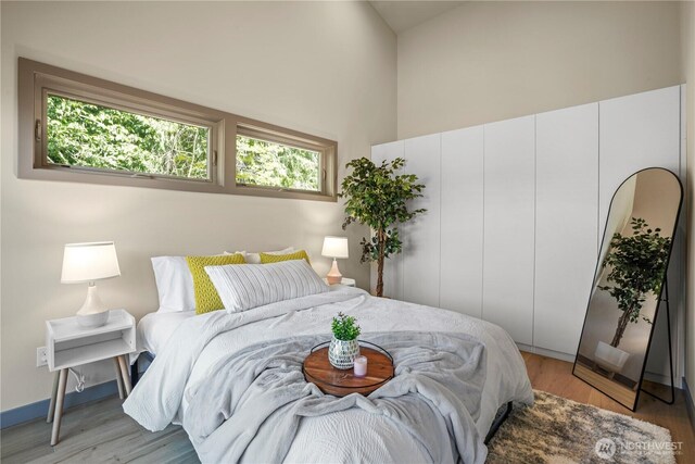 2324 NE 128th St, Seattle, WA 98125 - bedroom with a high ceiling and light wood-style floors