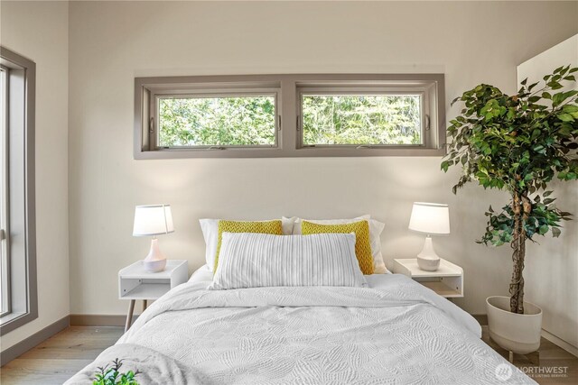 2324 NE 128th St, Seattle, WA 98125 - bedroom with multiple windows and wood finished floors