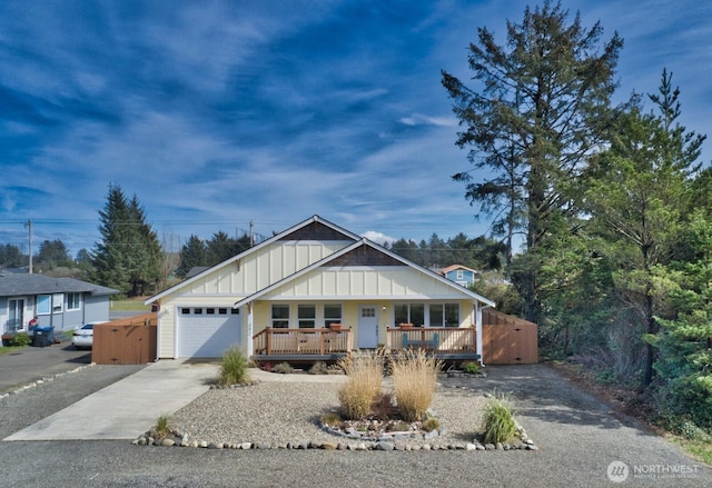 ranch-style house featuring a garage, concrete driveway, board and batten siding, and a porch