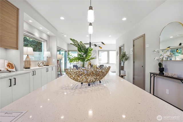 dining space with recessed lighting