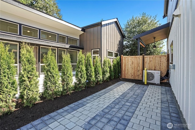 view of patio / terrace with ac unit and fence